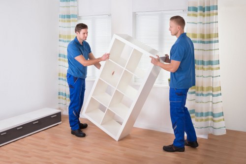 A family preparing for a house move with labeled boxes