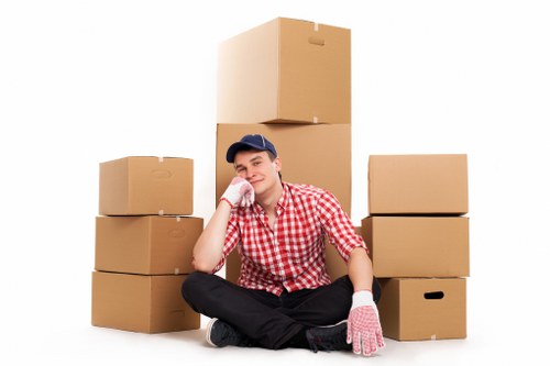 Furniture and boxes being loaded by a man and van service